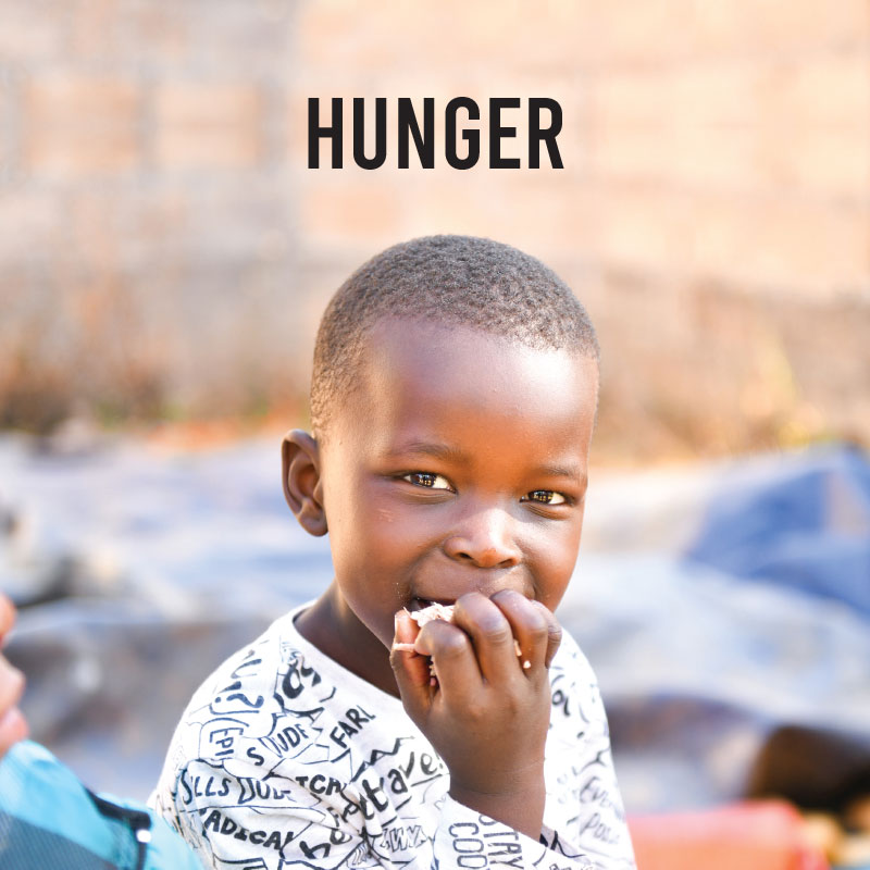 A child eating some food for hunger button.